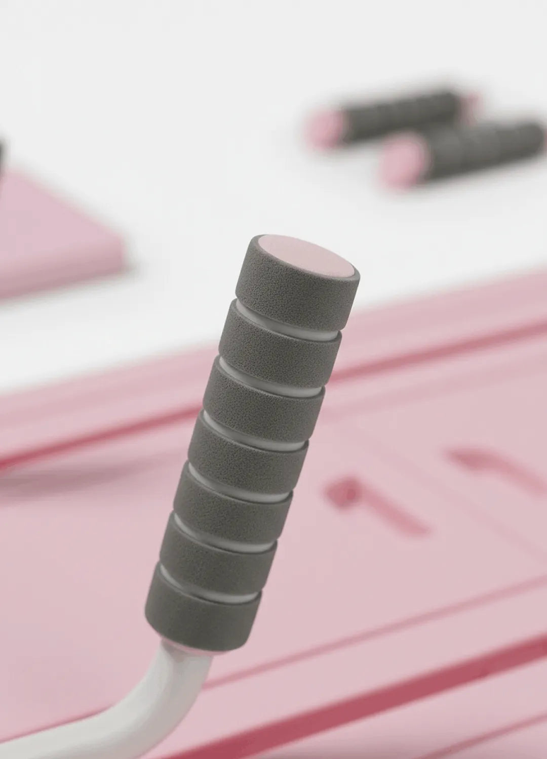 Détail poignées planche pilates rose